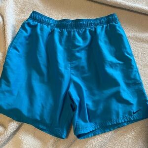 Nike Turquoise Sports Shorts Size large, missing draw string